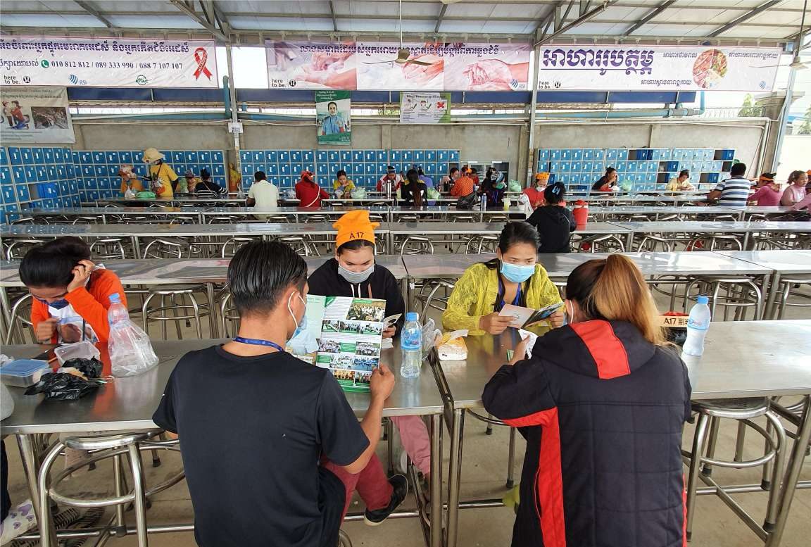 Employees Reading Training Materials During Lunch Break