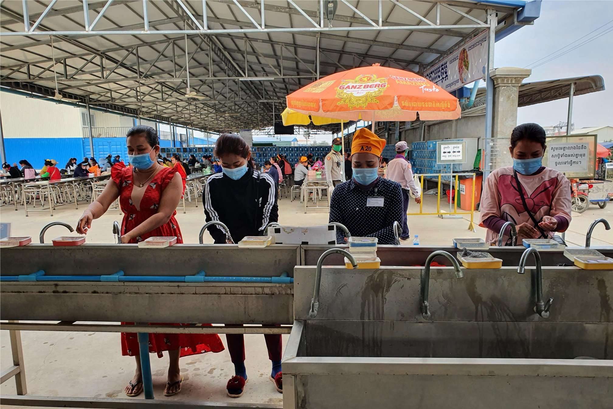 Employees Washing Their Hands Before Lunch